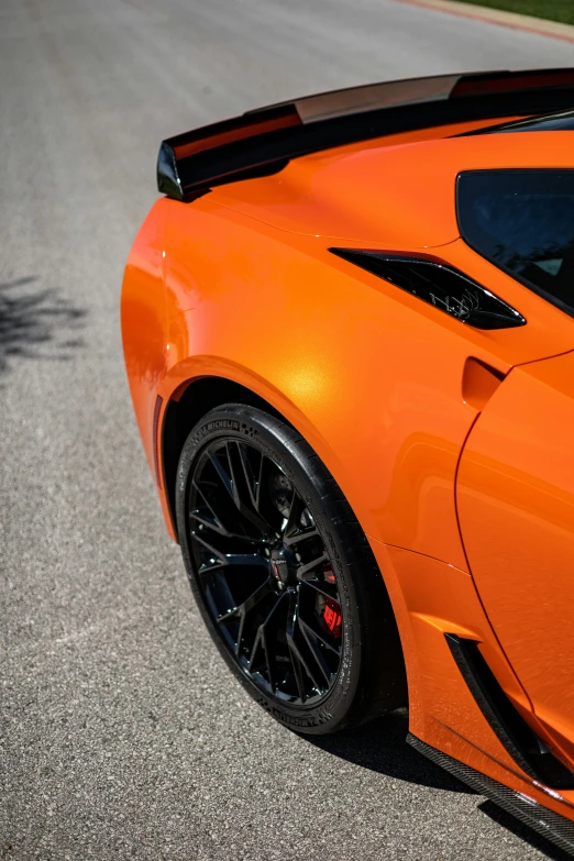 the tail end of a sports car on the street