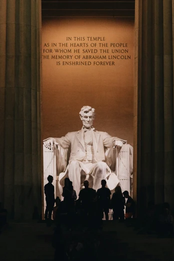 a group of people gathered around the lincoln memorial