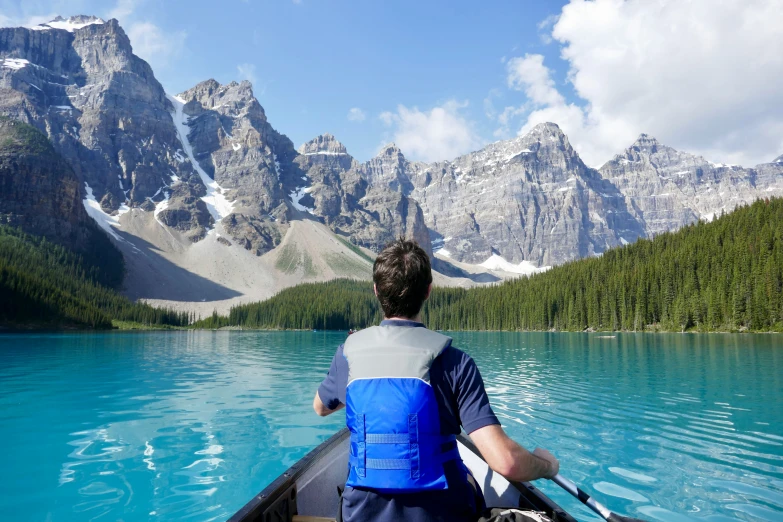 a person is in a small boat on the water