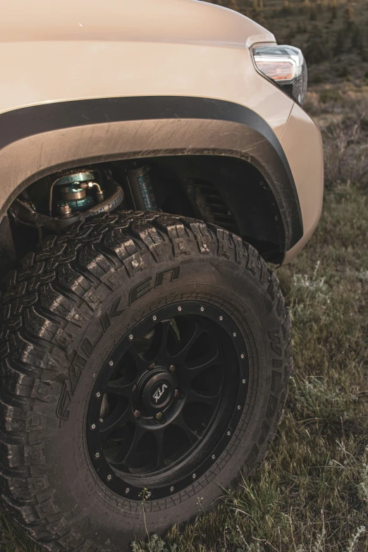 the back end of a truck parked in grass