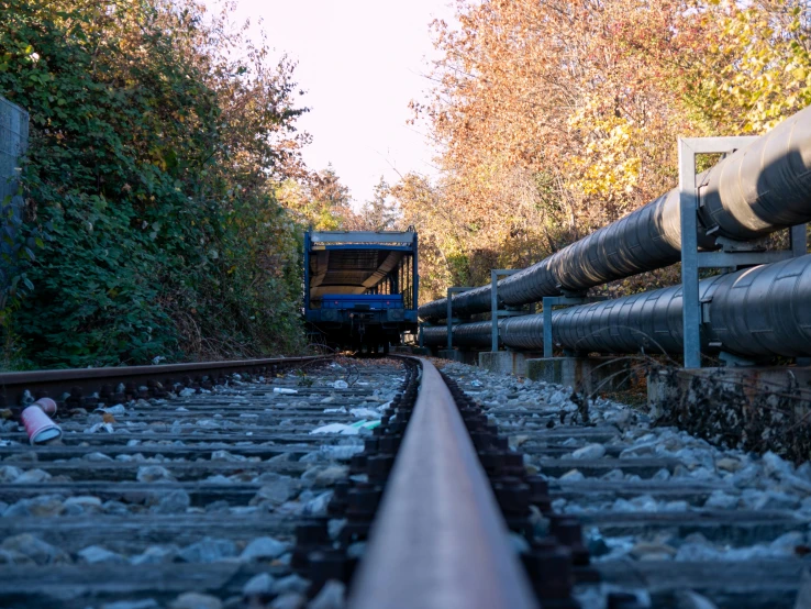 the view from the middle of an old train track