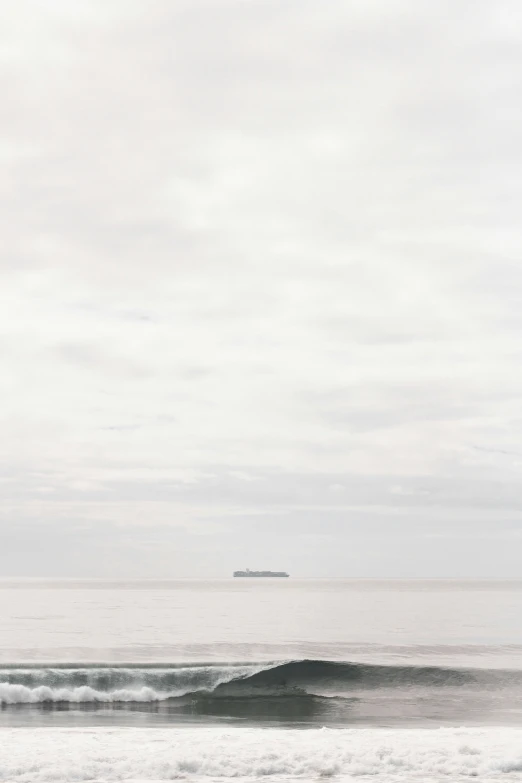 two people riding surf boards on a calm day