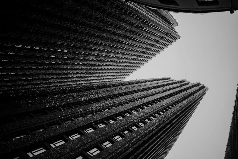 looking up at two skyscrs in the distance