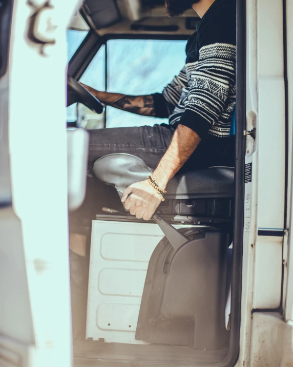 a woman that is inside of a van