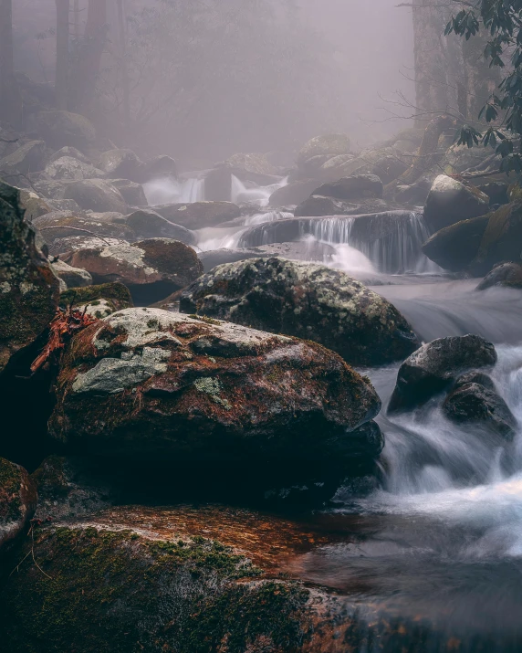 a mountain stream flowing between two big rocks