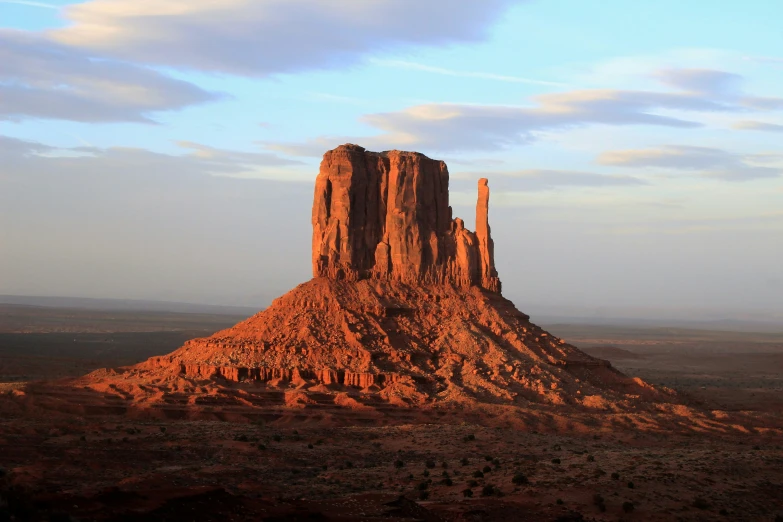 some very tall rocks in the middle of some desert