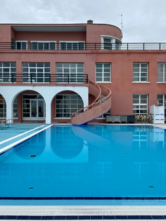 a building that is next to a large pool