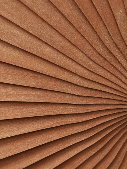 the back of a wooden blinds with brown colored pleating