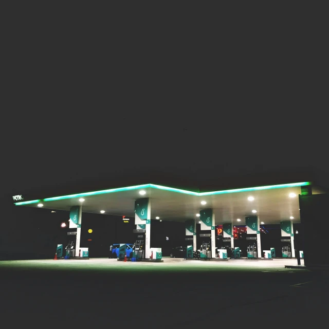 this gas station has many lights in the dark