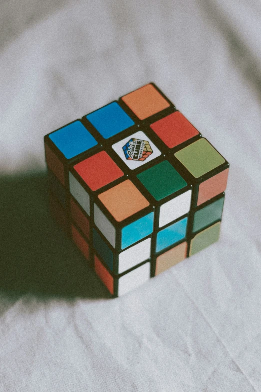 a rubik cube made of different colored squares