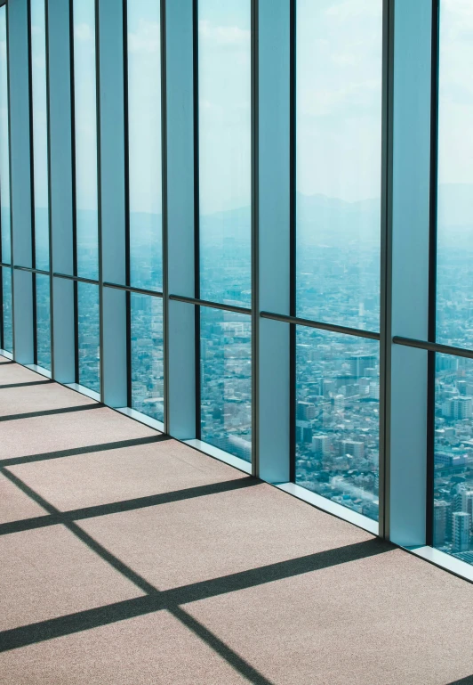 a window overlooking the city is shown through glass