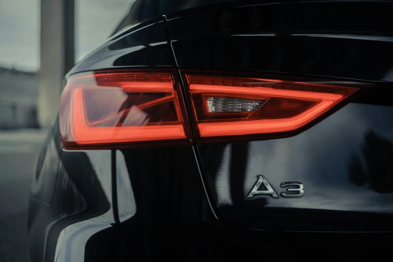 a car tail light with an audi logo