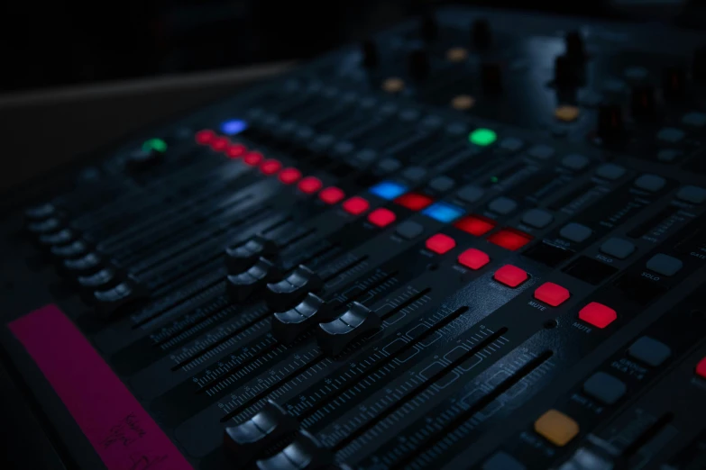 the electronic mixing console has a multi - colored 