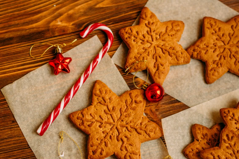 gingerbread cut - out cookies, candy cane and decorations