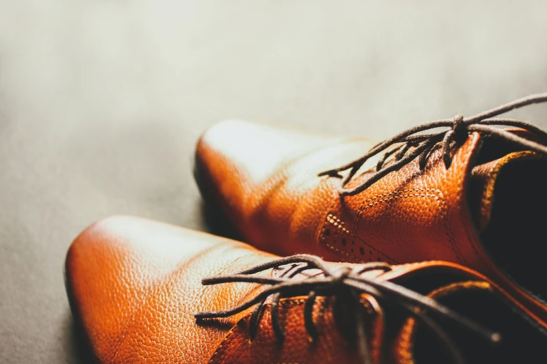 two orange shoes that have their tops showing