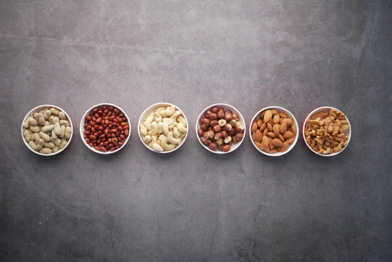 bowls lined up in the shape of four, all different types of grains