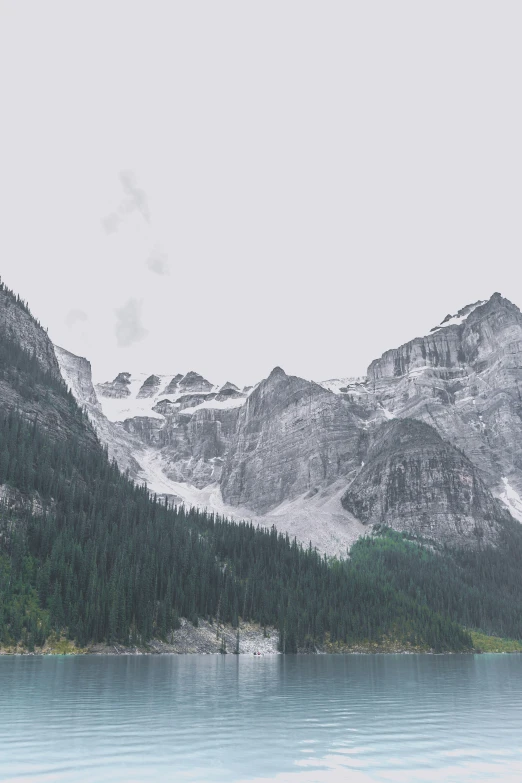 some very pretty mountains covered in snow and water