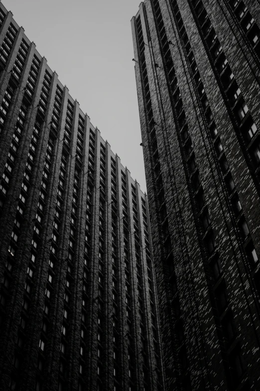 some tall buildings with windows and a clock