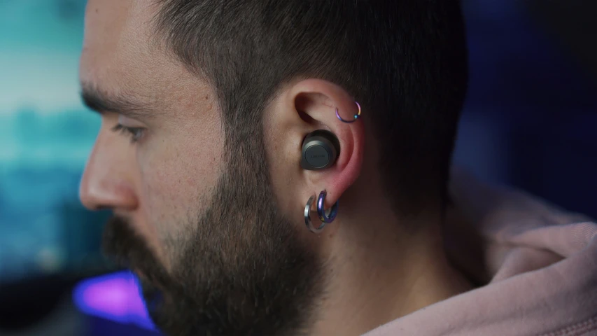 a man's ear has several circles around it
