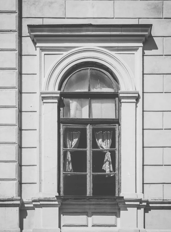 black and white image of a window with an open screen