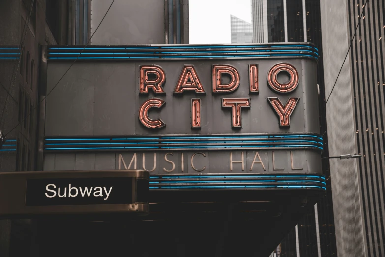 a sign on the side of a building advertising radio city music hall