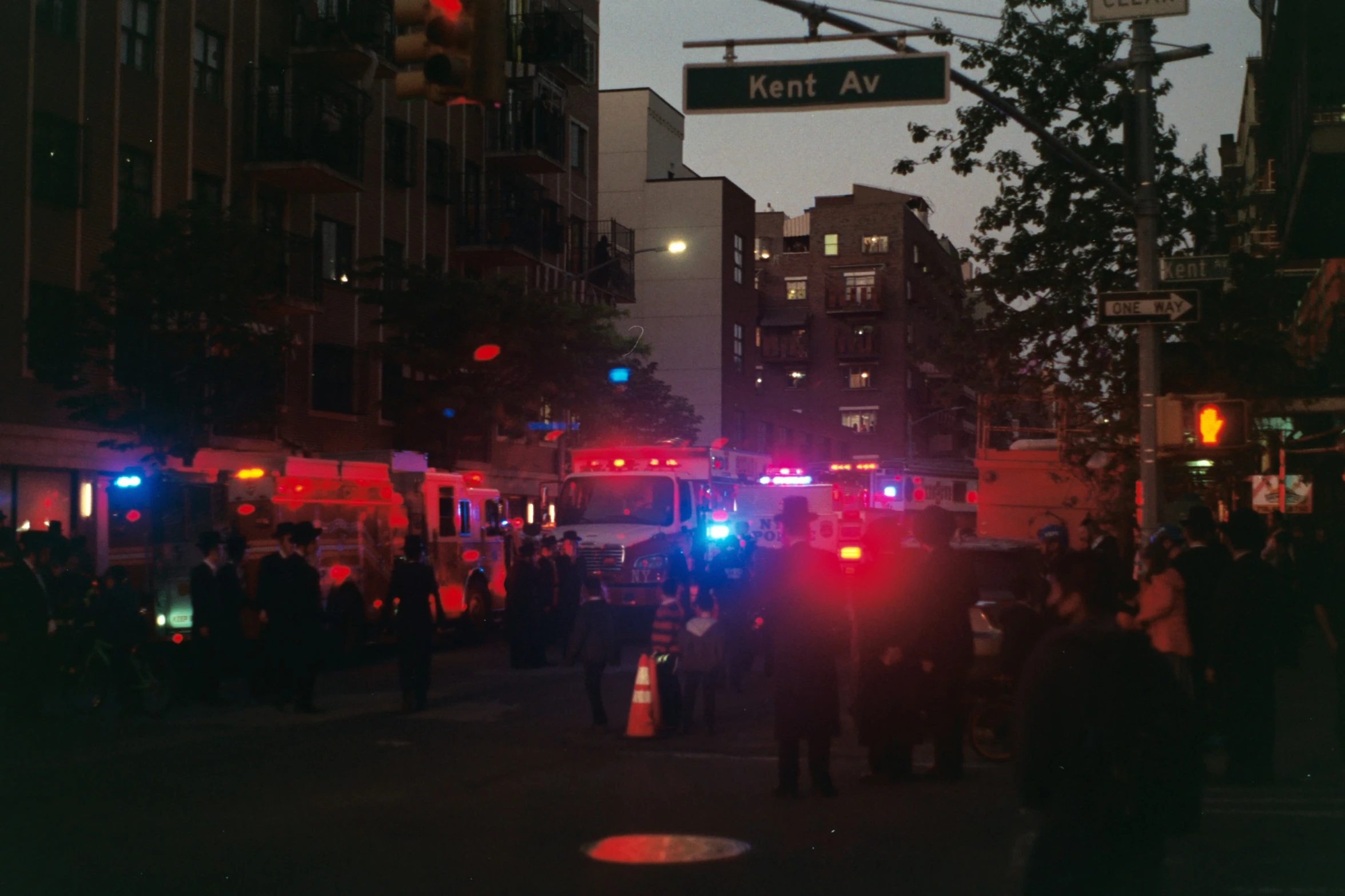 police block off the intersection while people gather in the city