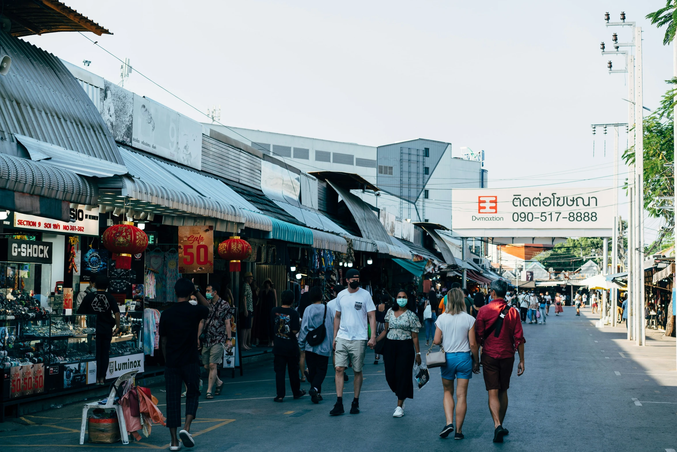 the pedestrian walk features shops and businesses as well as several pedestrians