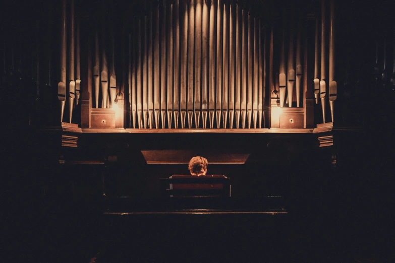 a  plays on a pipe organ