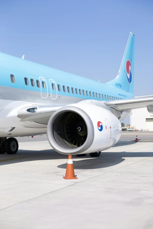 the engine of a commercial airplane sitting on the tarmac