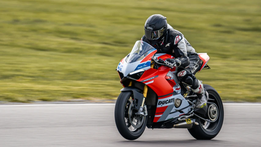 a person on a motorcycle going down a track