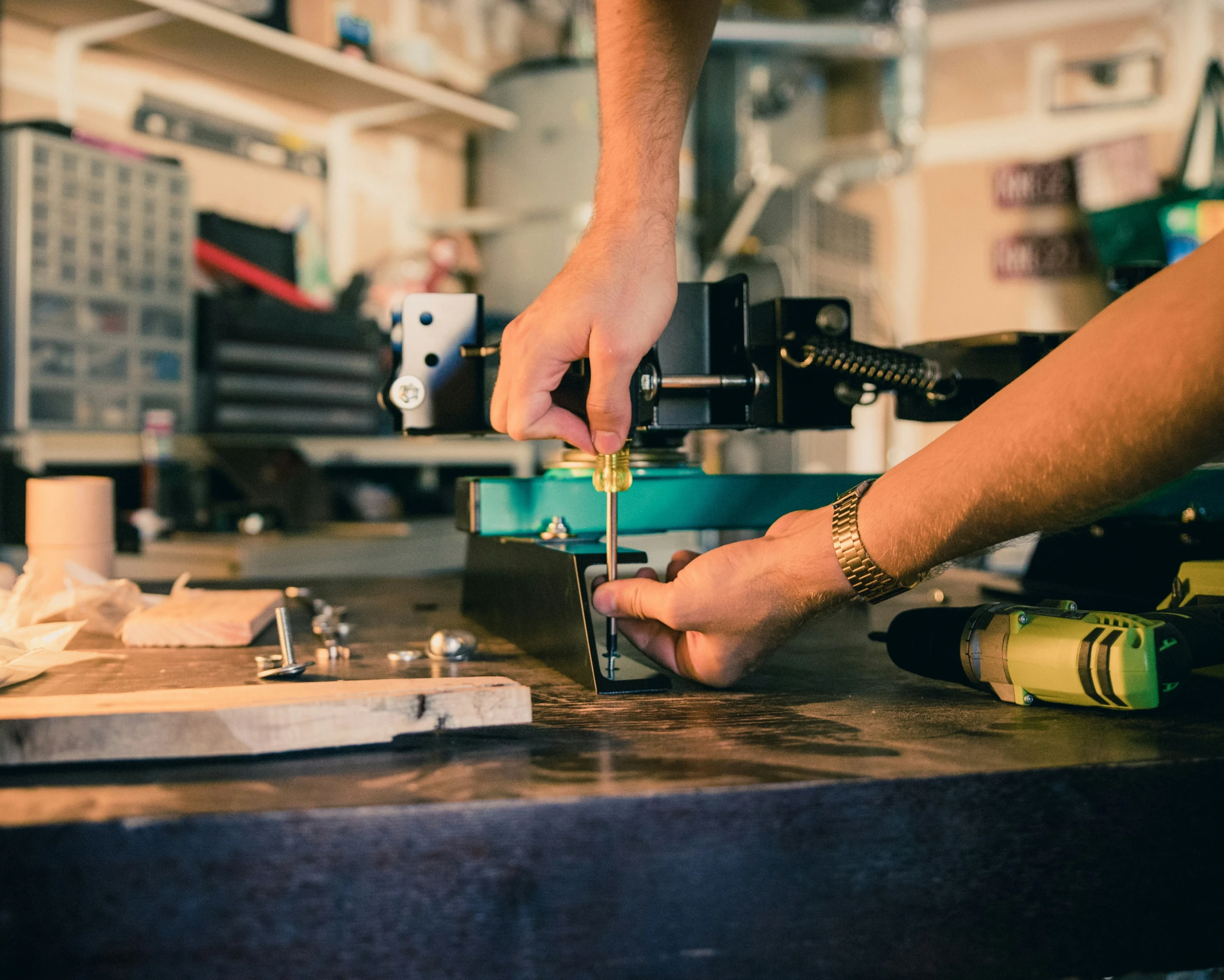 a person working on an electric part with some tools