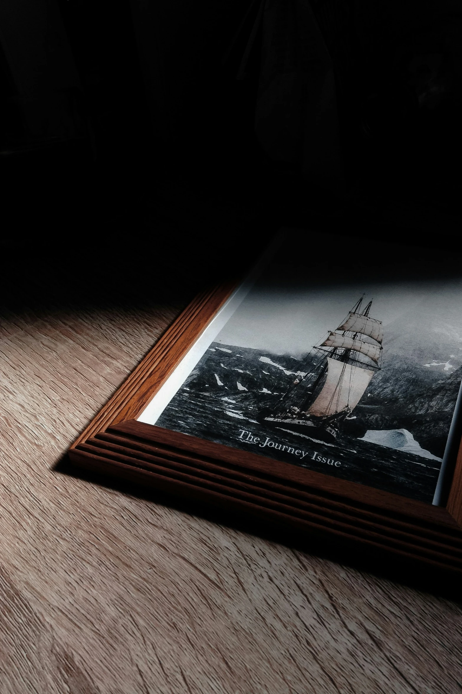 a close up s of wood with a ship in the background