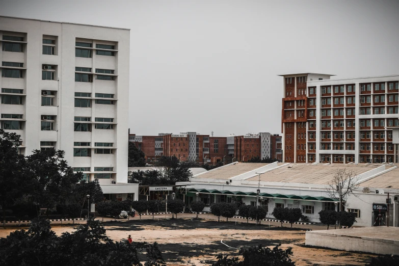 large buildings on an overcast day with one building almost gone