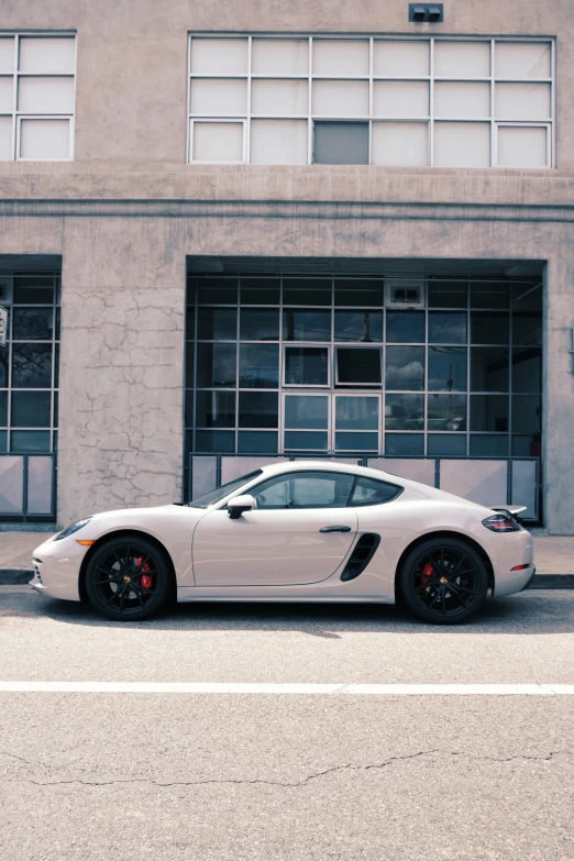 a very cool looking sports car parked outside of a building