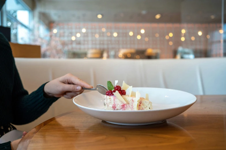 a bowl of dessert sitting on top of a table