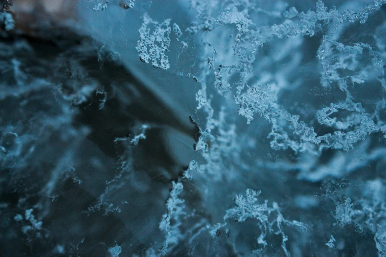 an abstract, textured surface with ice like substance on it