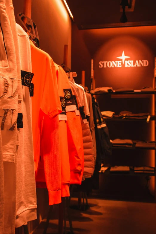 a shop with shirts hanging up on racks