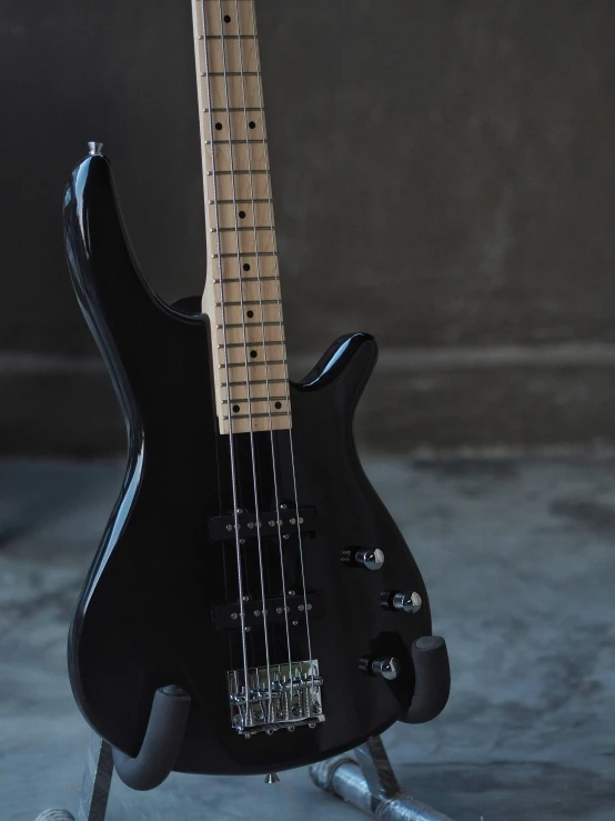 an electric bass guitar in a black case