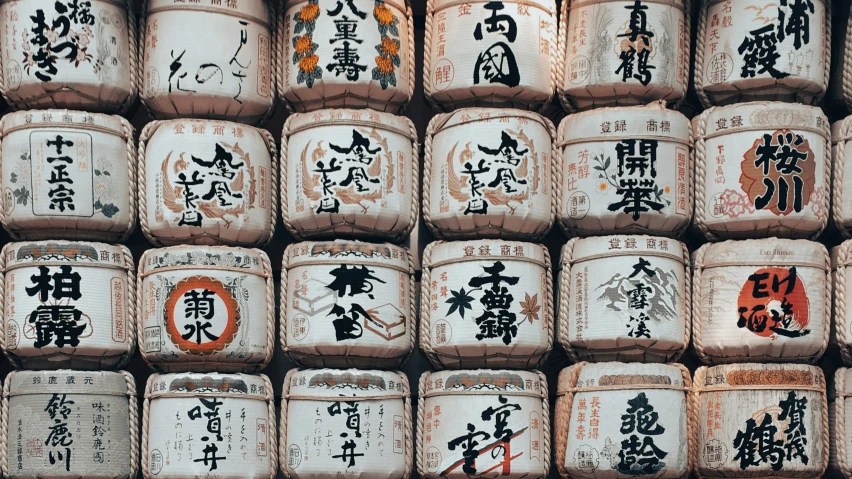 a very old pile of rice drums on display