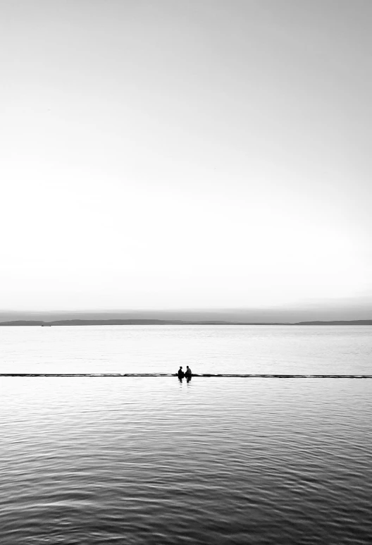 a single jet ski being ridden in the ocean