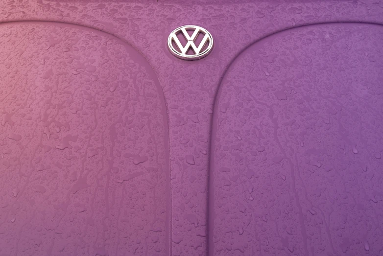 the vw logo is on a purple cloth