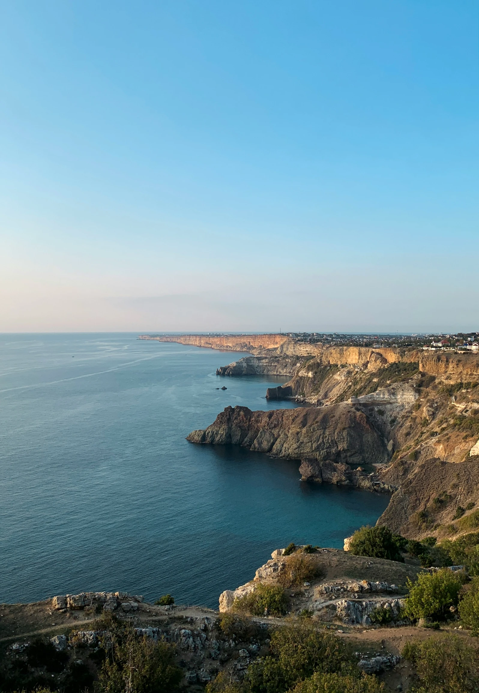 the view over an ocean and a few cliff outcropping