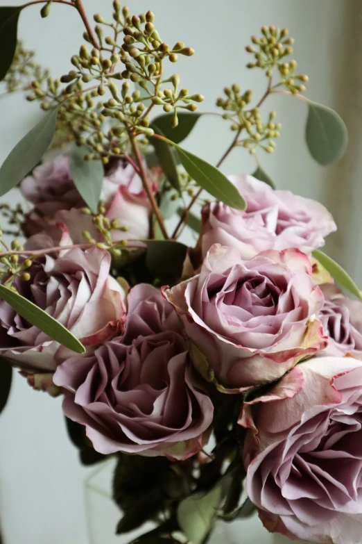 a bunch of pink roses is in the vase