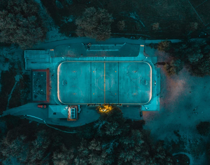 an aerial view of a bus stop in the evening