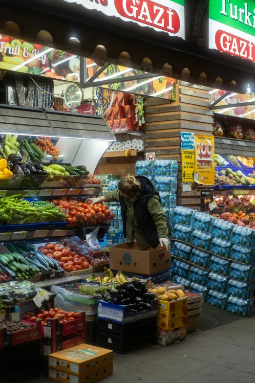 a produce section in a grocery store filled with fruit and vegetables