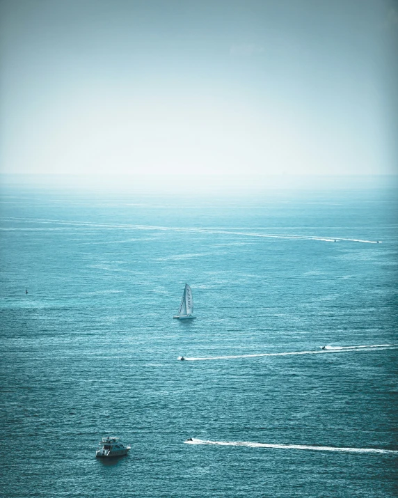 an ocean view with boats on the water