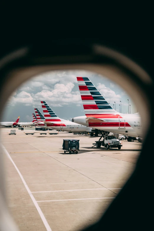 a few planes sitting on top of an airport tarmac