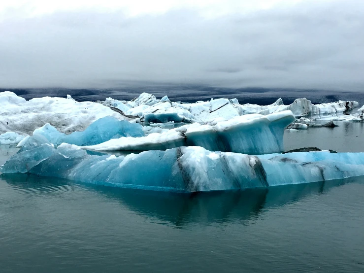 the ice is melting and shining in the water