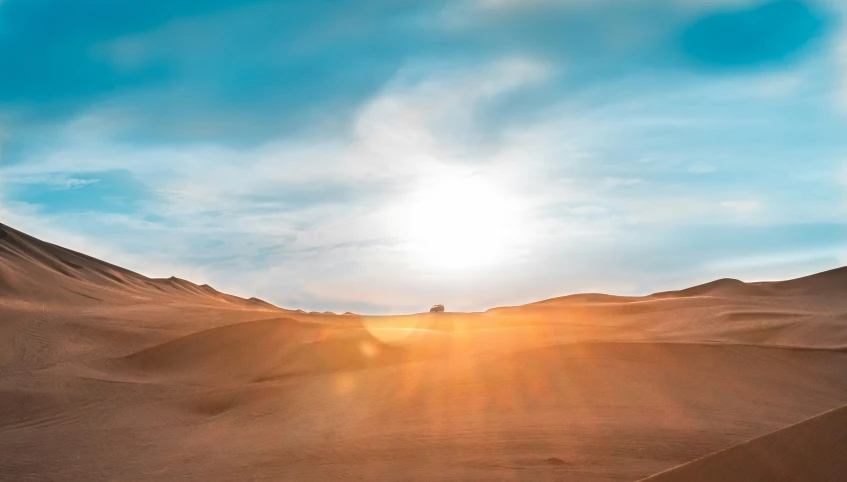 a person riding a board through the desert