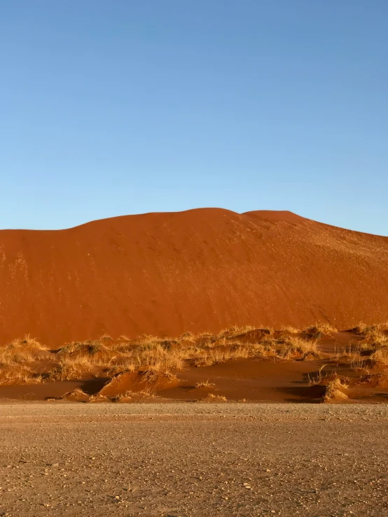 the large red rock looks like soing out of africa